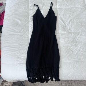 Lulu’s black ribbed form-fitting black dress with fringe detail, size M